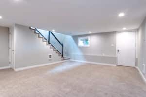 Light spacious basement area with staircase.